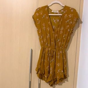 Mustard yellow romper with flower details
